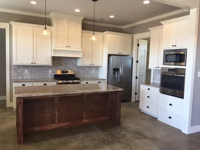 Interior residential painting in kitchen with cabinets